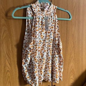 —Large Mock Neck Sleeveless Top